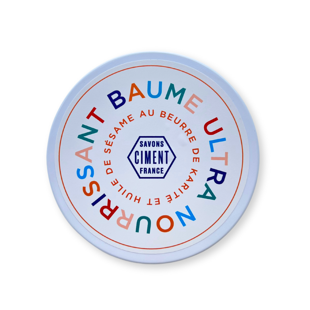 Lata de Baume Ultra Nourrissant de Ciment Paris vista desde arriba. Bálsamo nutritivo con textura rica y fragancia empolvada.