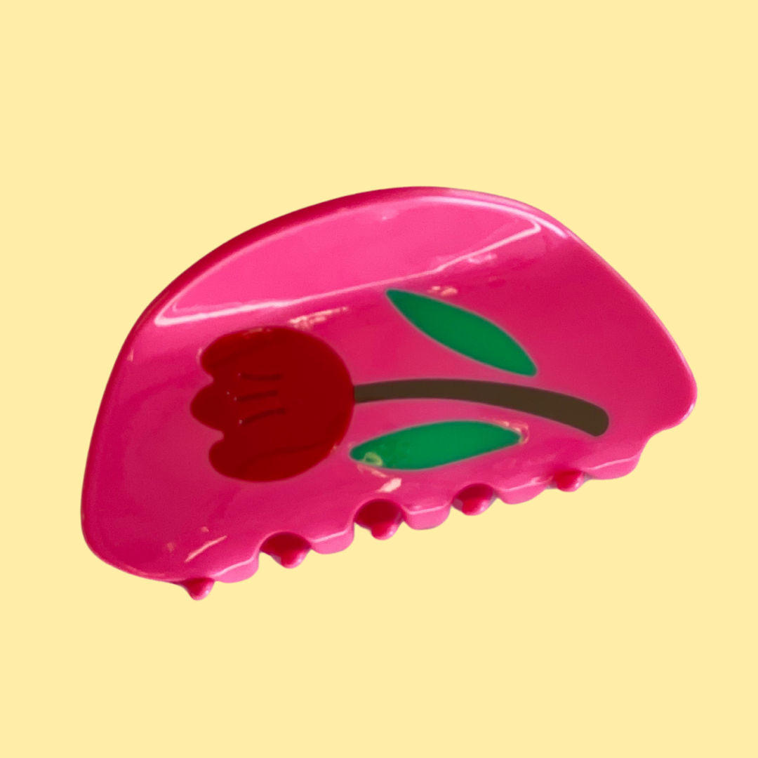 Pinza tulip para recogidos de pelo. Pinza de tonos rosas y rojos de La Crème Organics, ideal para despejar tu pelo de forma estilosa.