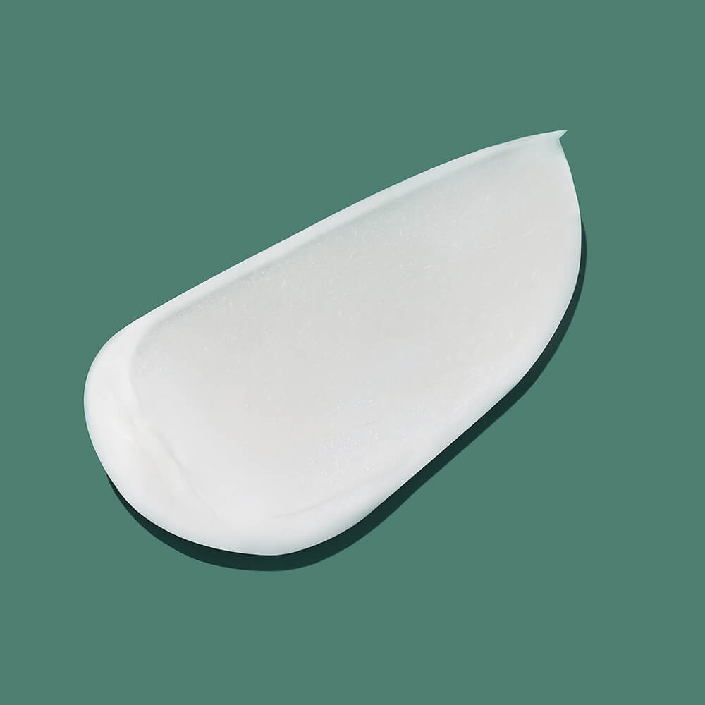 Textura cremosa del acondicionador Hydrating Cream, rica en emolientes naturales.